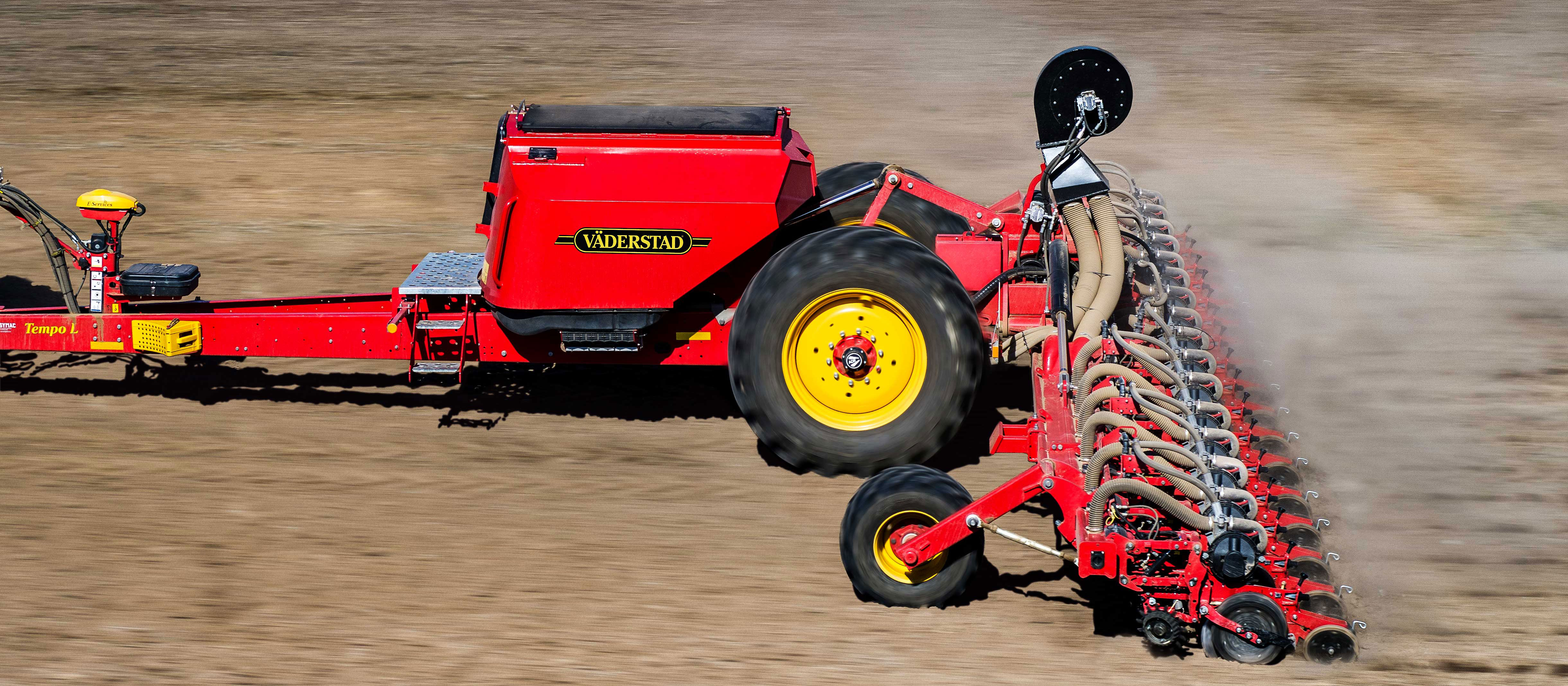 A red Tempo machine going on the field.