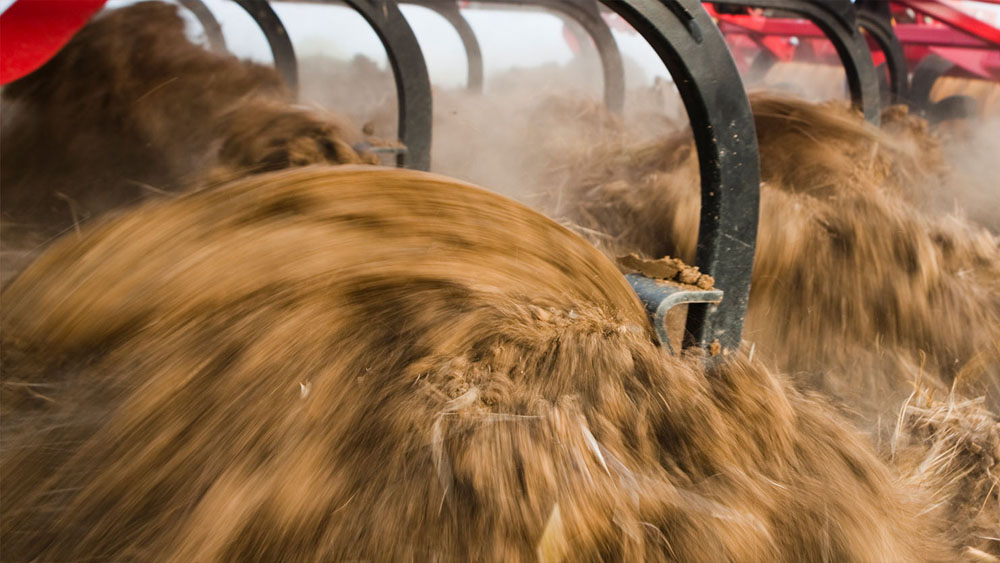 Close-up of the Väderstad MixIn shin on a machine working in the field