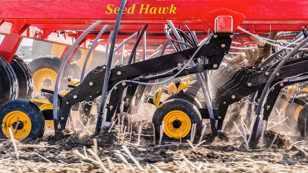 Detail photo of the Seed Hawk coulters in the ground
