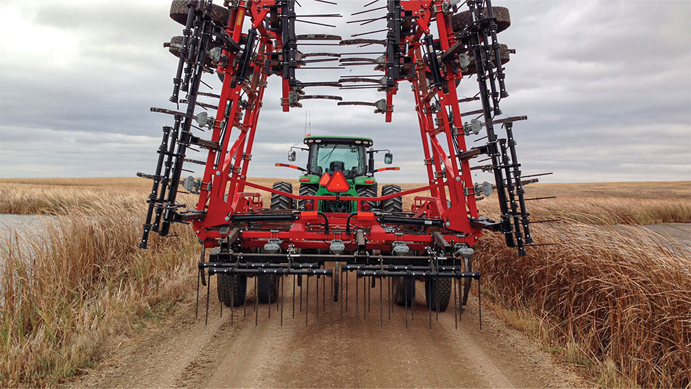 Wil-Rich 2500 Chisel Plow with wings folded, on a road